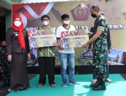 Kolonel Inf Faisol Secara Simbolis Menyerahkan 20ribu Penerima BT-PKLWN di Makodim 0410/KBL